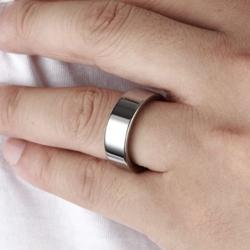 Man tries on his silver tungsten ring